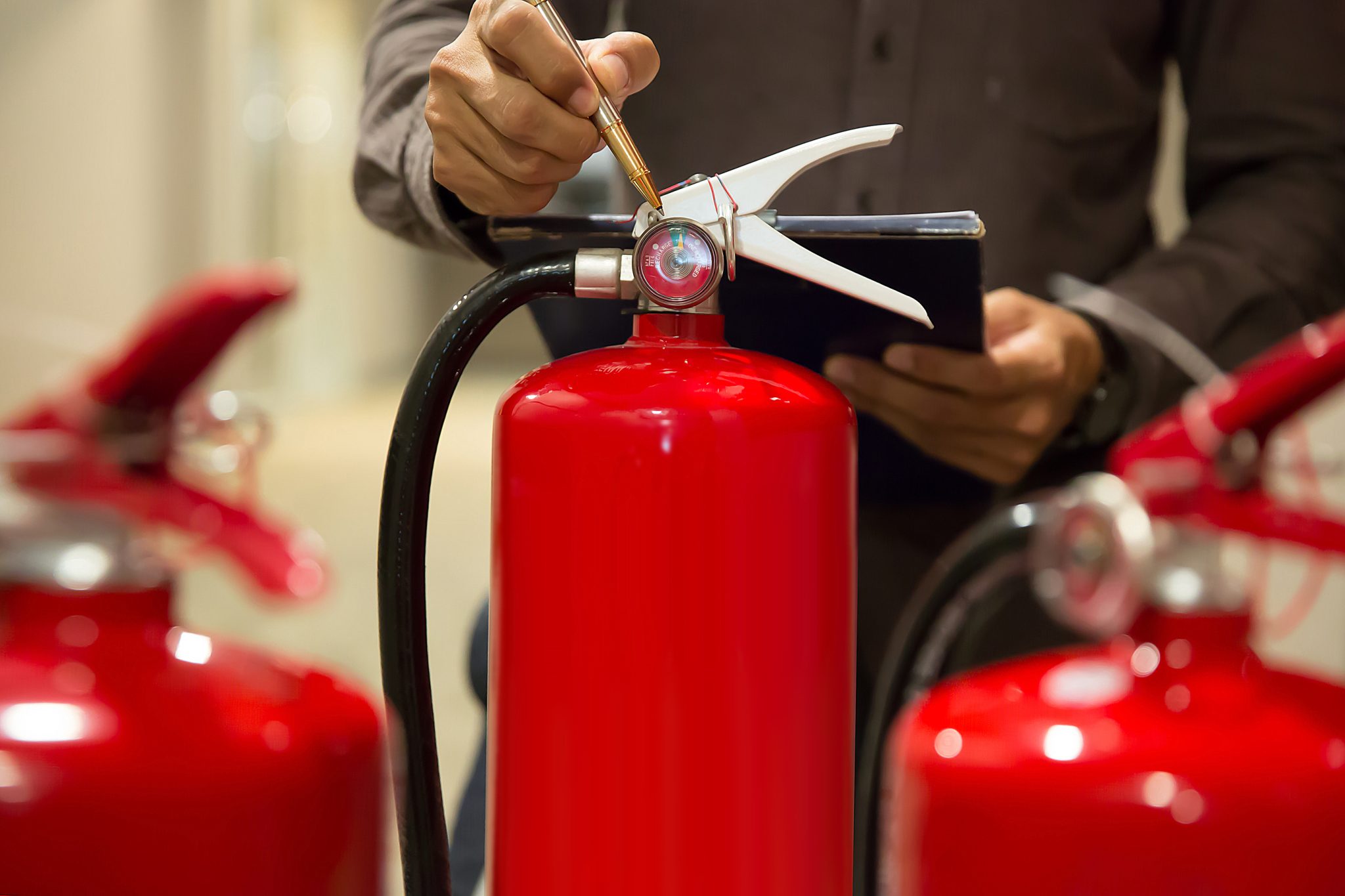 engineers-are-checking-fire-extinguishers-159251858